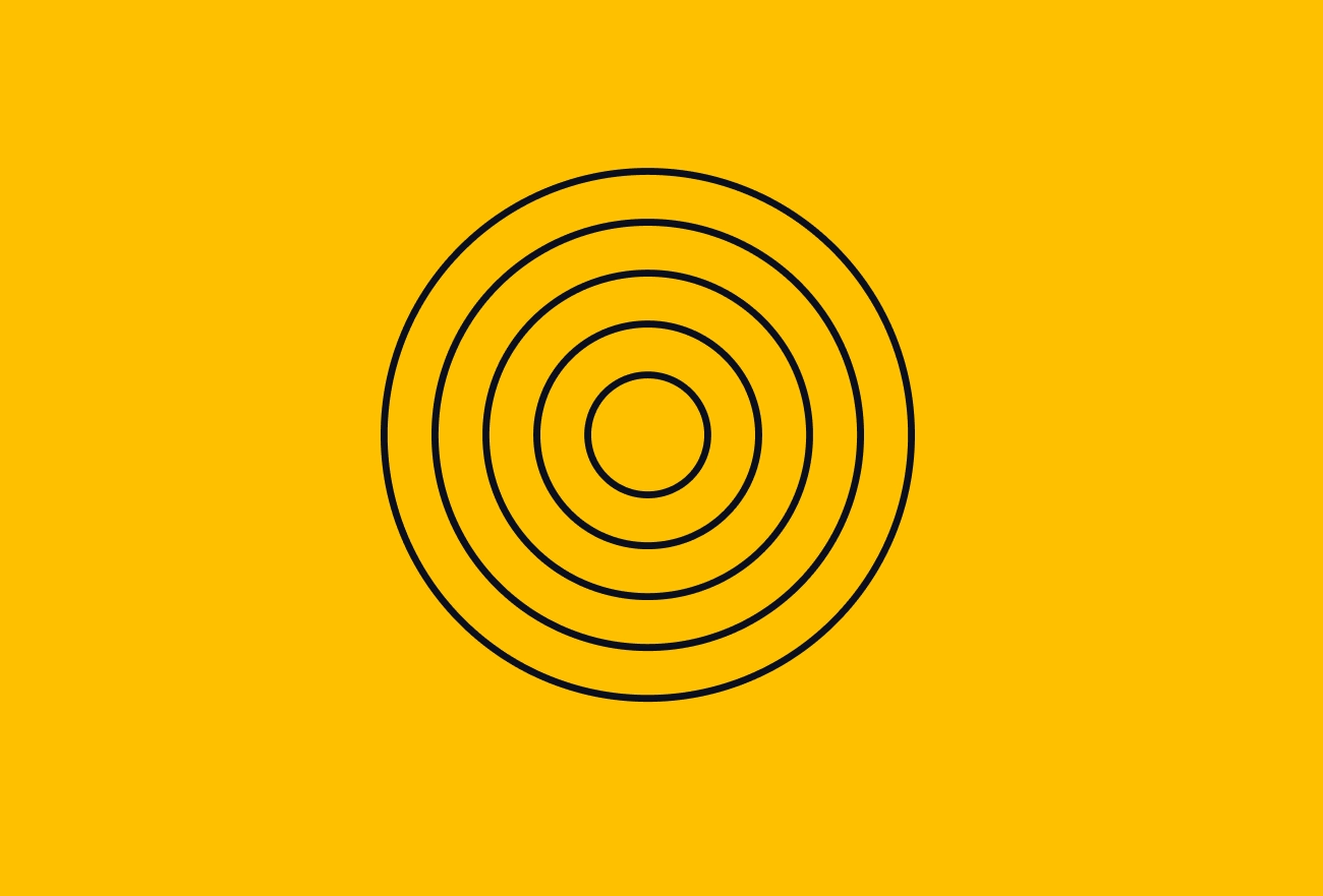 Concentric black circles on bright yellow background