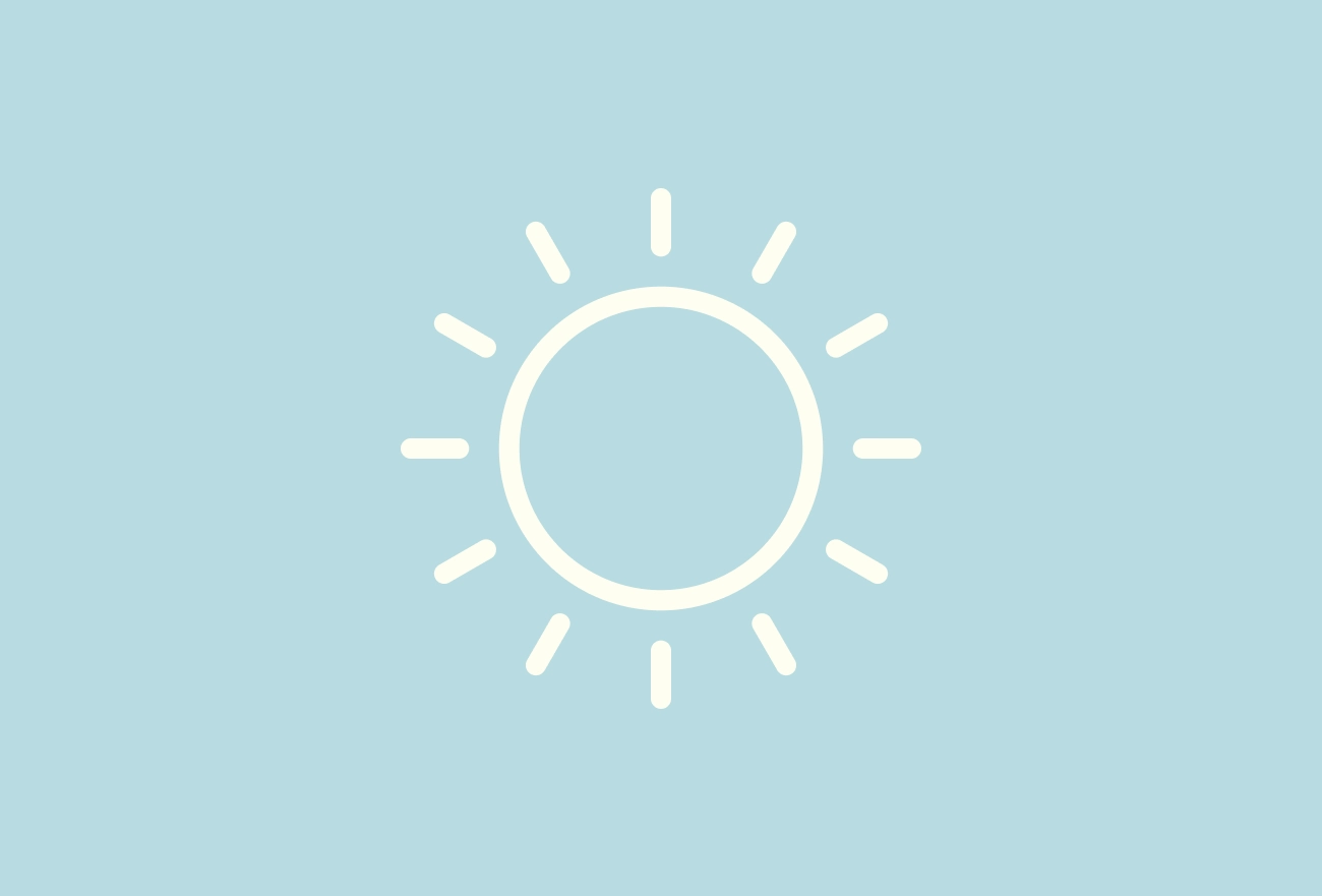 Sun icon with rays on light blue background