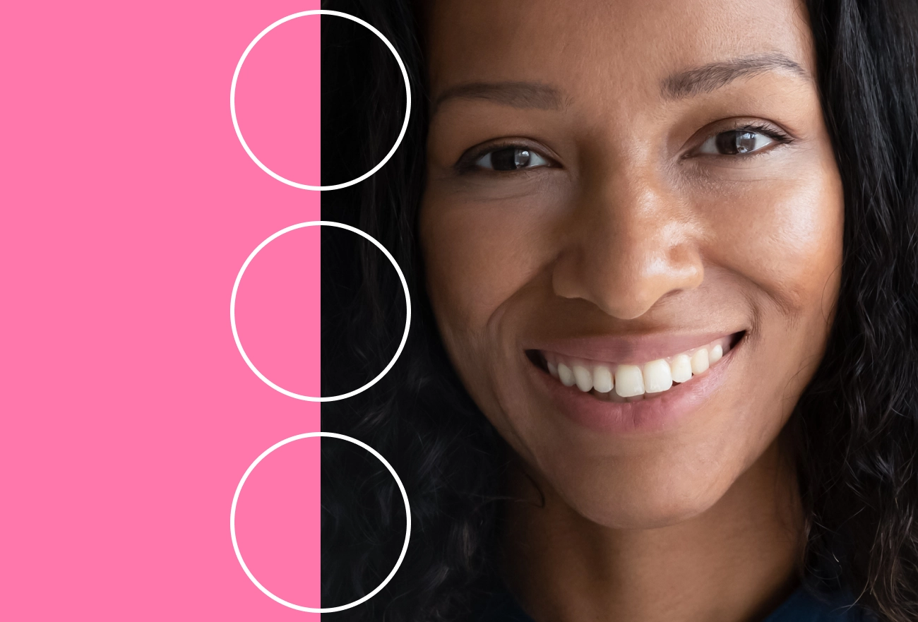 Woman smiling next to split pink and black background with three white circles