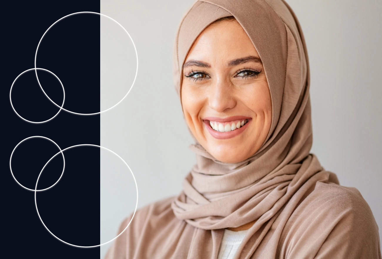 Smiling woman wearing tan hijab next to geometric overlapping circles pattern design