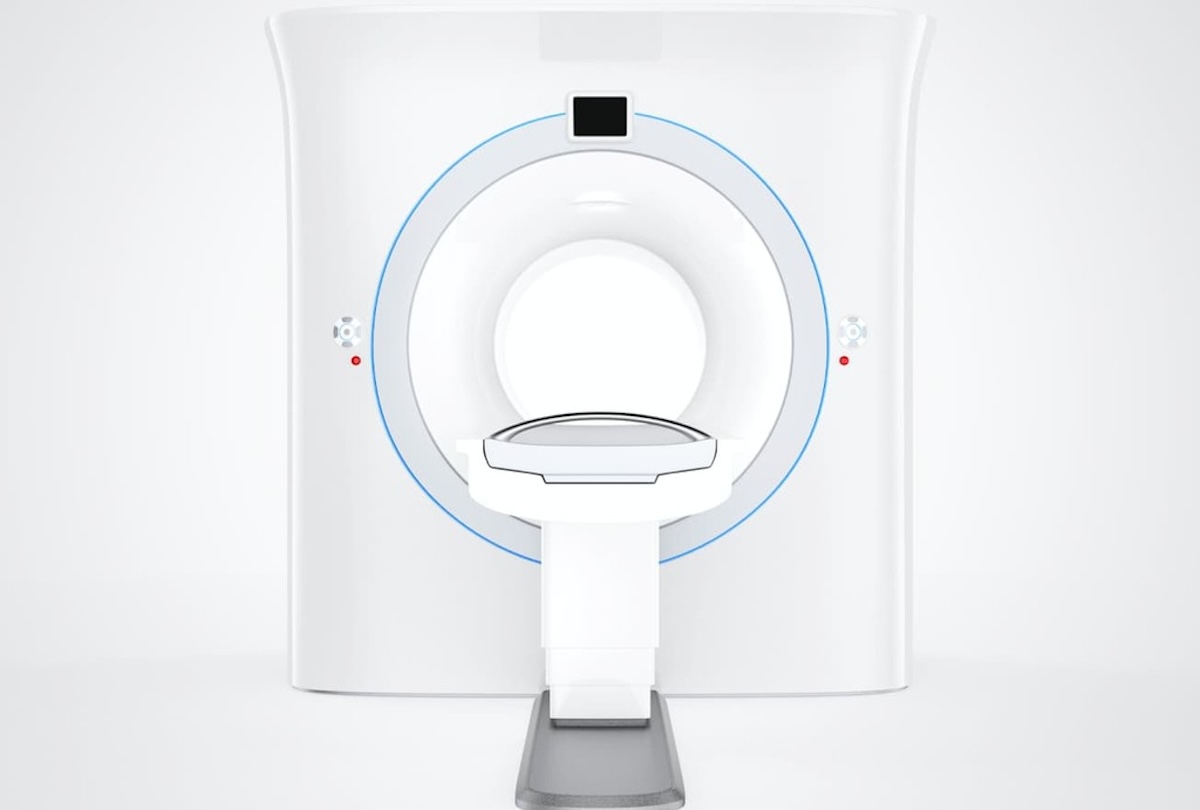 Front view of modern CT scanner with circular opening and patient table