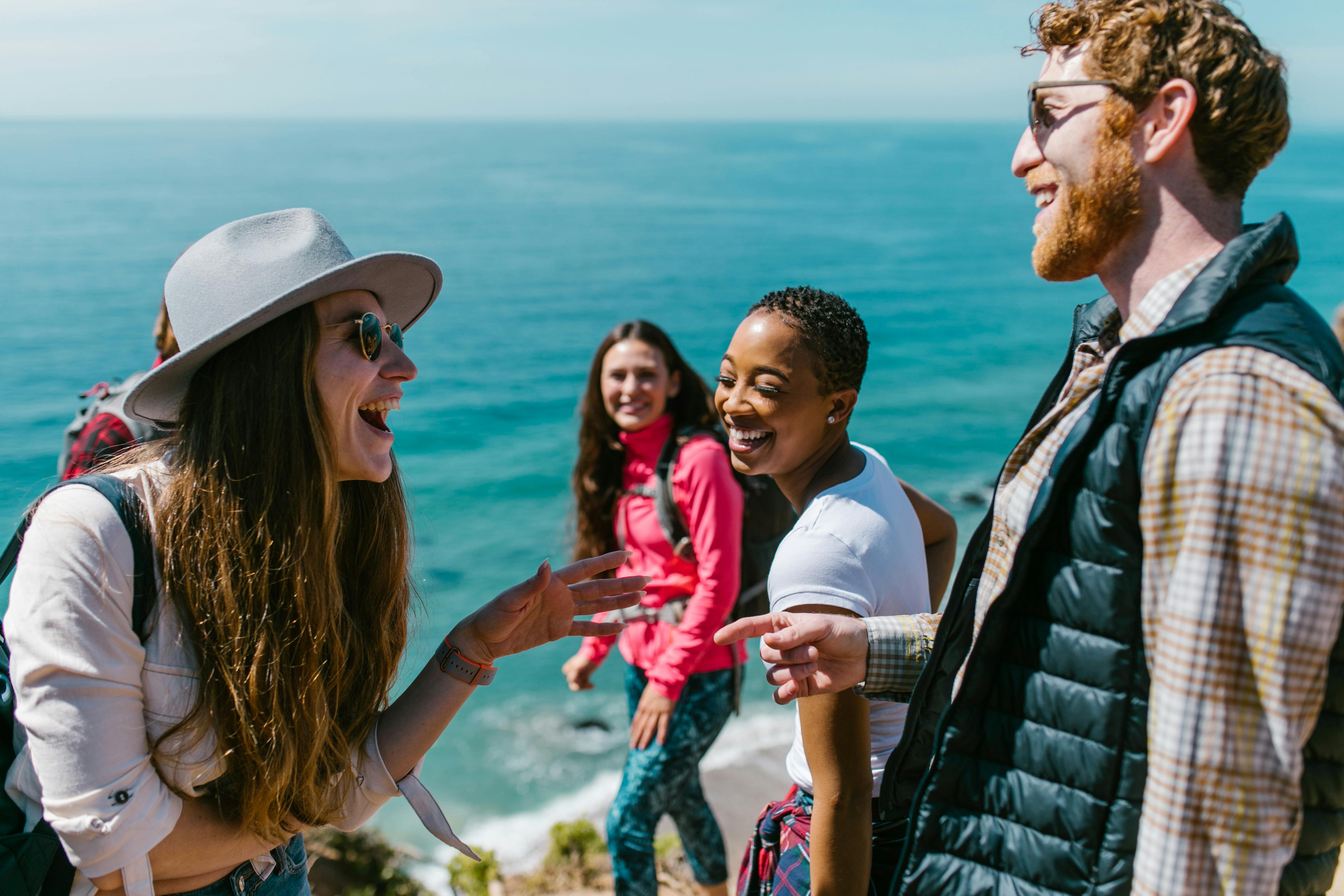 Group of friends on a hike, smiling and laughing together
