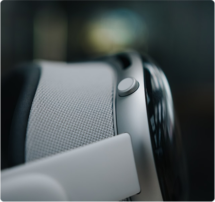 Close-up of a VR headset showing a textured fabric strap and a circular adjustment knob.
