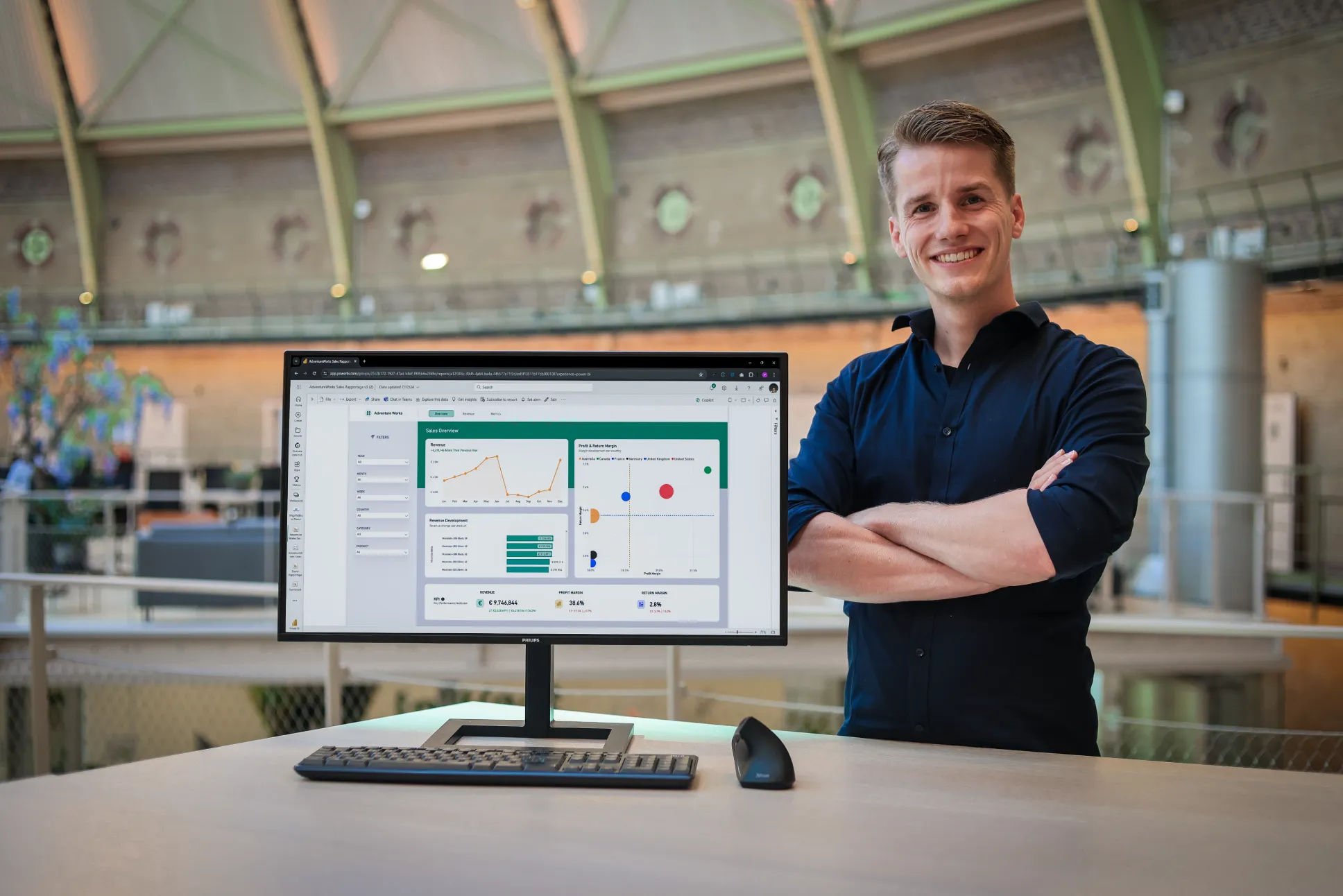 Patrick of WegMetExcel next to a Power BI dashboard