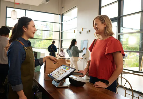 woman picking up an order at a fast casual dining restaurant