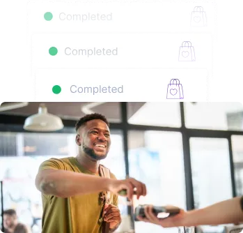 man in a retail space paying with a credit card for a purchase