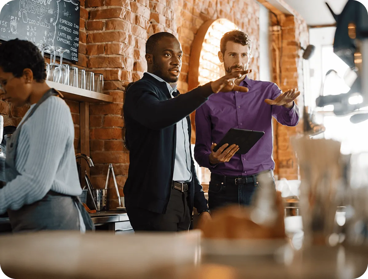 restaurant owner and manager discussing the table layout before opening the restaurant