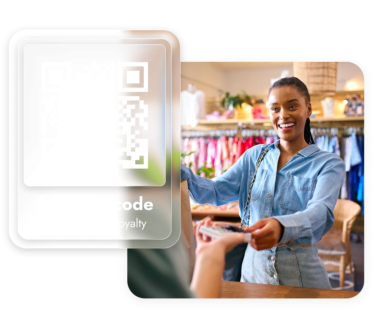 Smiling woman in denim shirt making a purchase with a card in a clothing store.