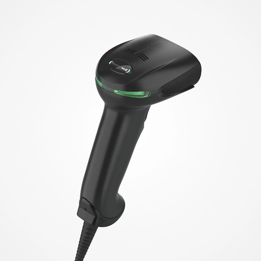 Black Honeywell handheld barcode scanner with green light and wired connection.