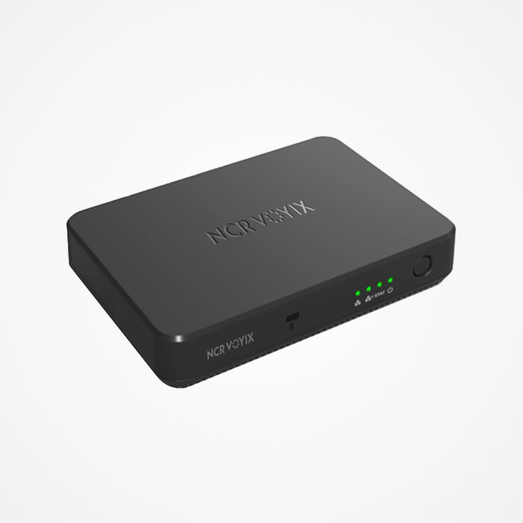 Black NCR Voyix media player with power button and green indicator lights on front panel.
