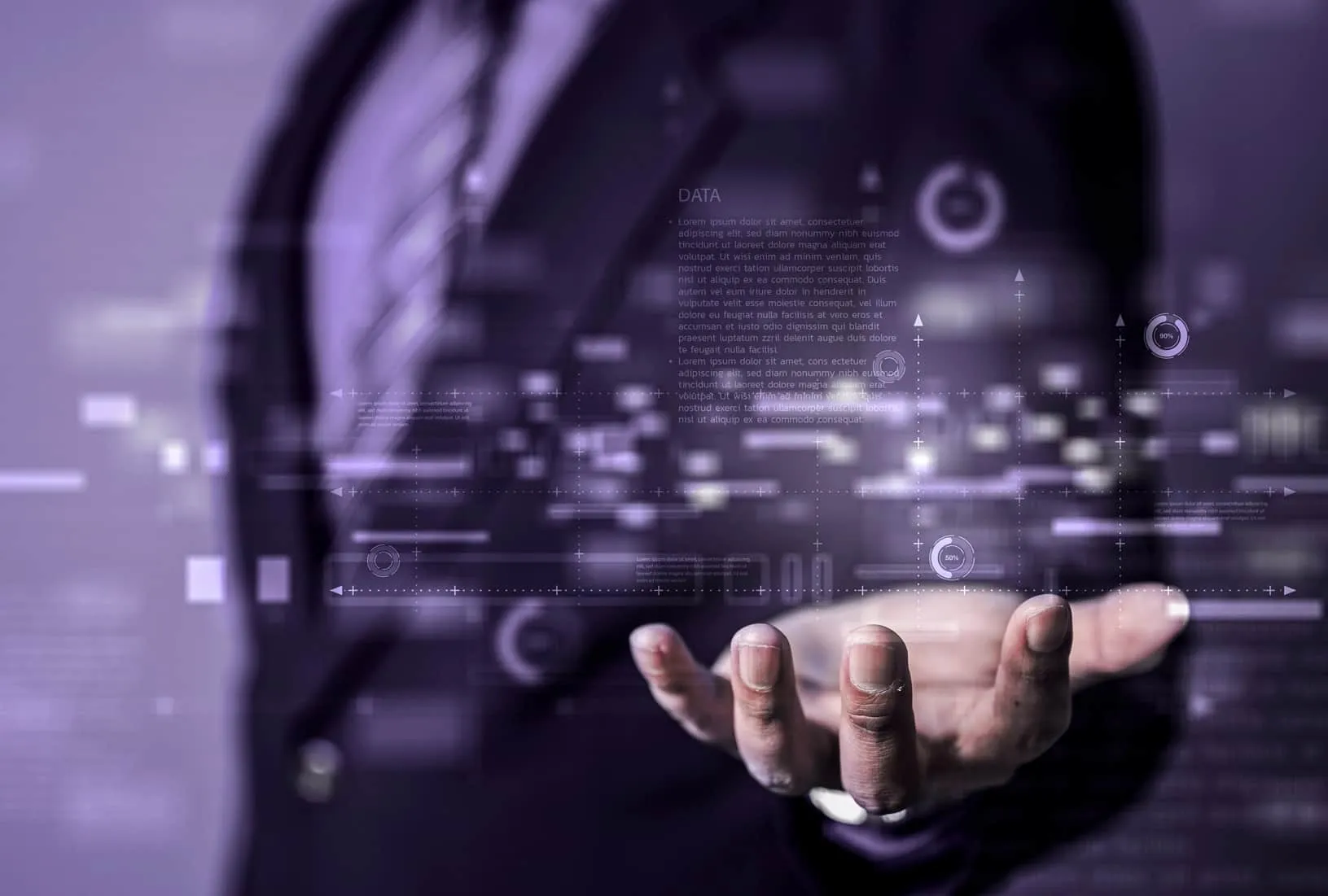 Businessman in suit with hand extended showing digital data and futuristic interface graphics.