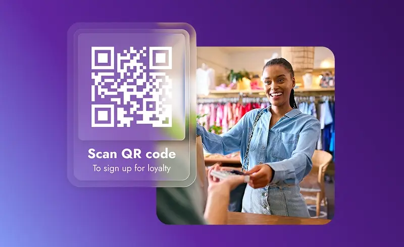 Smiling woman scanning QR code in store to sign up for a loyalty program.