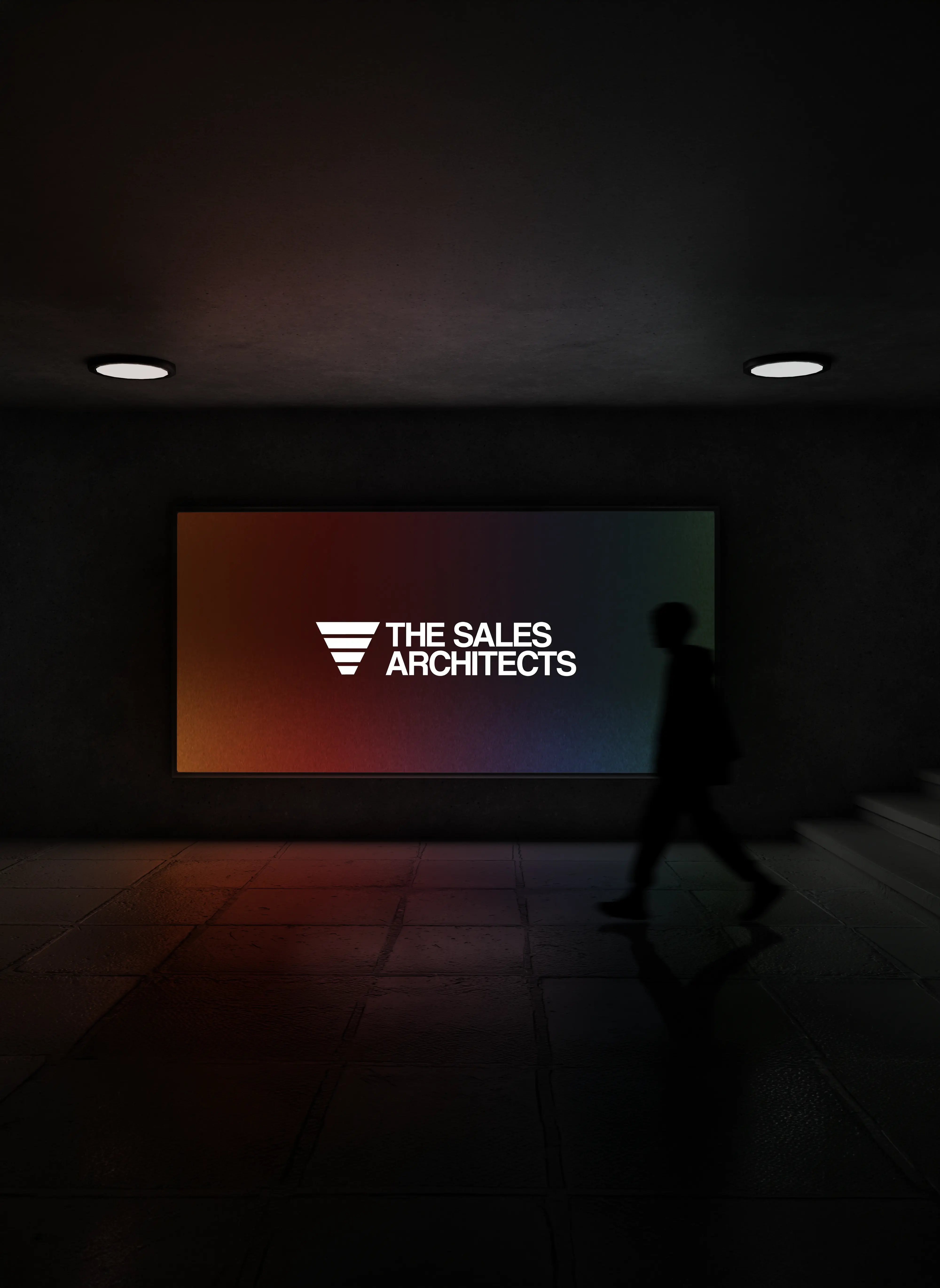 Dark hallway with a large illuminated sign reading 'THE SALES ARCHITECTS' and a silhouette of a person walking by.