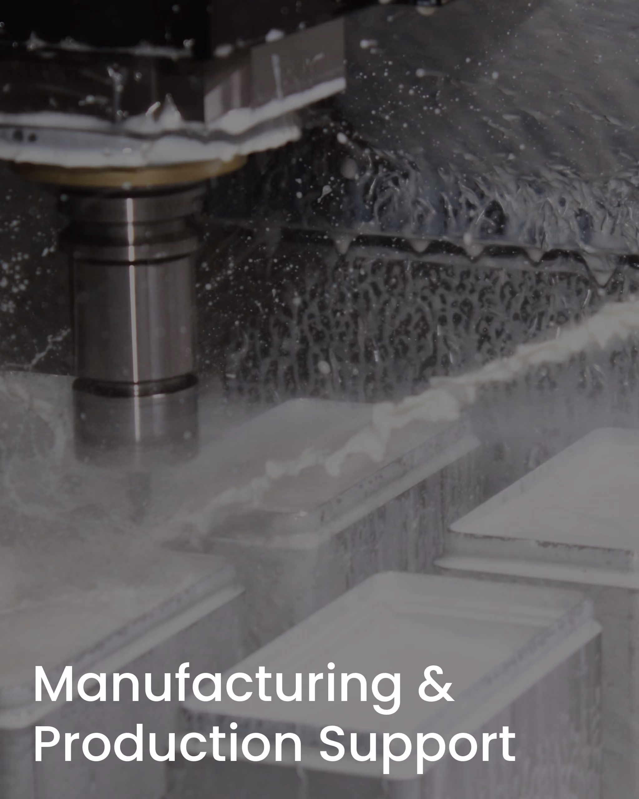 Close-up of a CNC milling machine cutting metal with coolant fluid spraying.