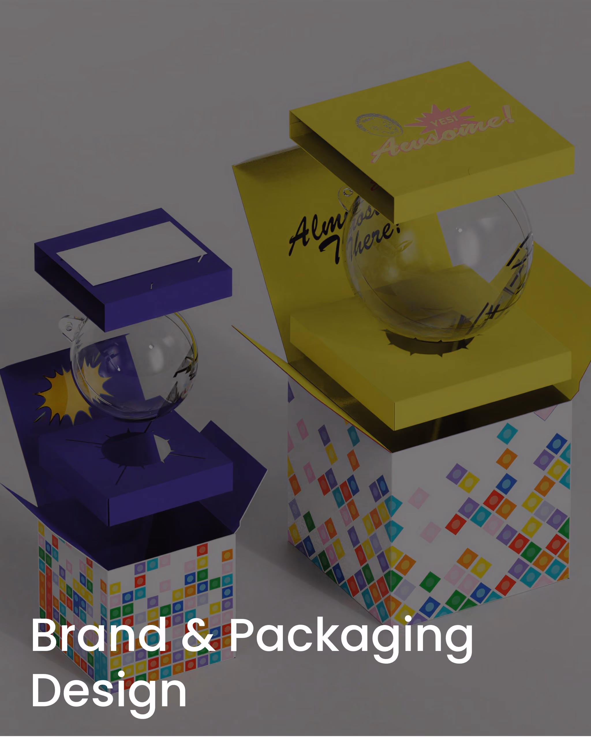 Two colorful open boxes with transparent spheres inside featuring bright geometric patterns.