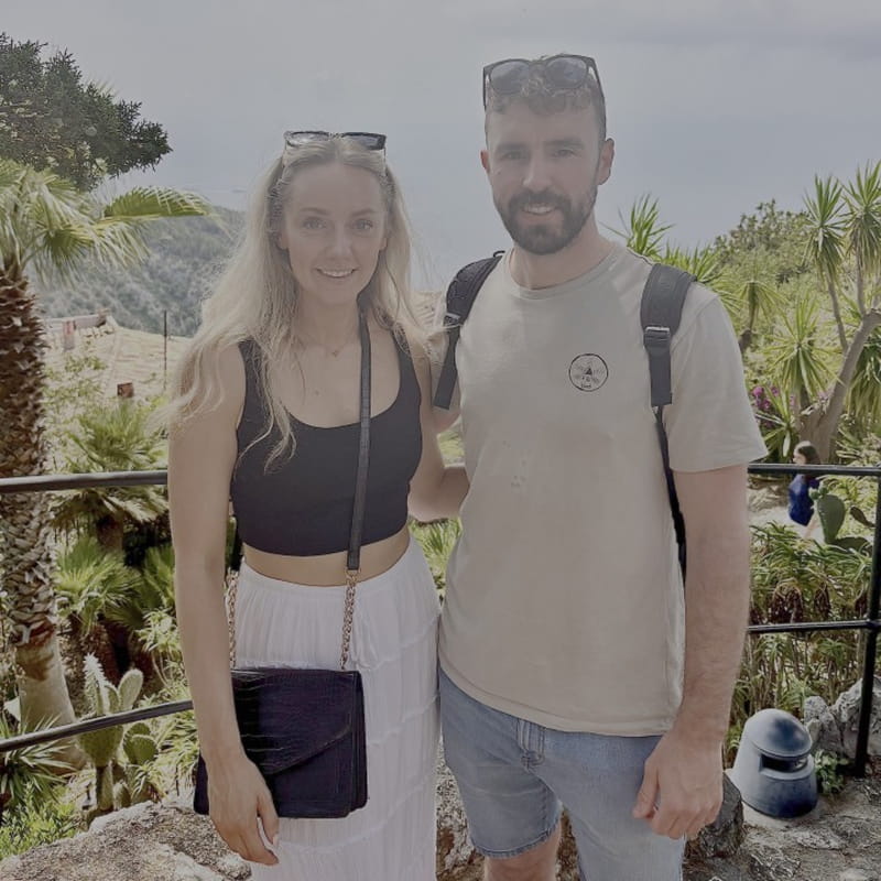 Emily and her partner on holiday