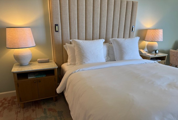 Four Seasons Resort Palm Beach signature bed with crisp white Four Seasons linens that are available for purchase due to guest demand