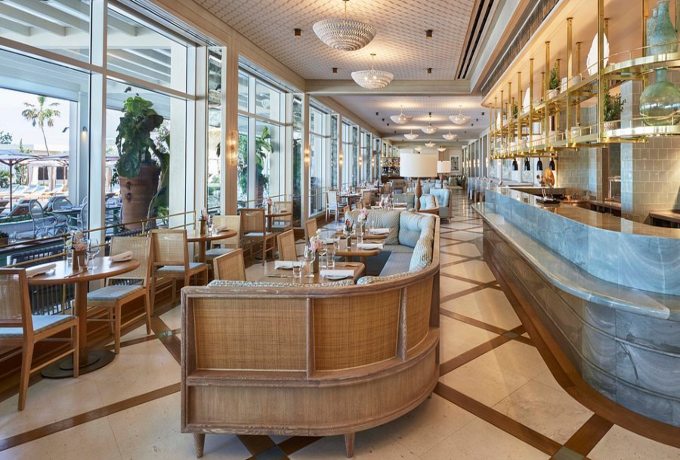 Interior of Florie’s restaurant at Four Seasons Resort Palm Beach with elegant coastal décor