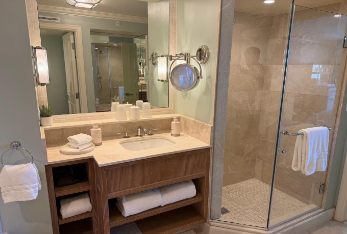 Bathroom at Four Seasons Resort Palm Beach with single vanity, luxury amenities and a rain shower