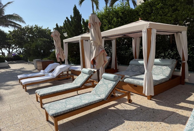 Loungers and cabana by the pool at Four Seasons Resort Palm Beach