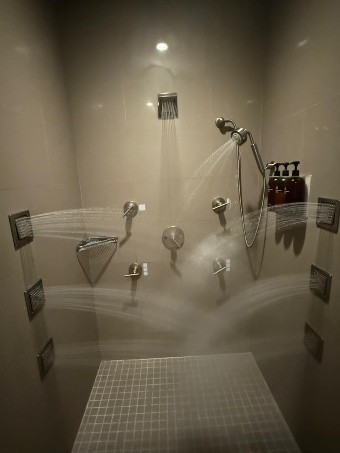 Multi-spray shower in the spa at Four Seasons Resort Palm Beach with adjustable jets for a relaxing hydrotherapy experience