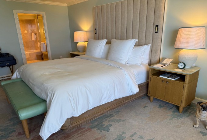 Guest room at Four Seasons Resort Palm Beach with coastal décor and natural light