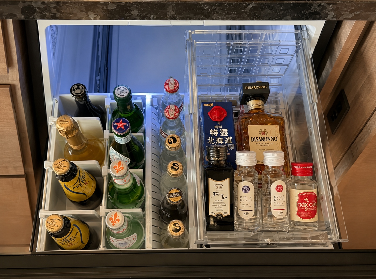 In-room minibar at Four Seasons Hotel Tokyo at Otemachi with beer, spirits and soft drinks