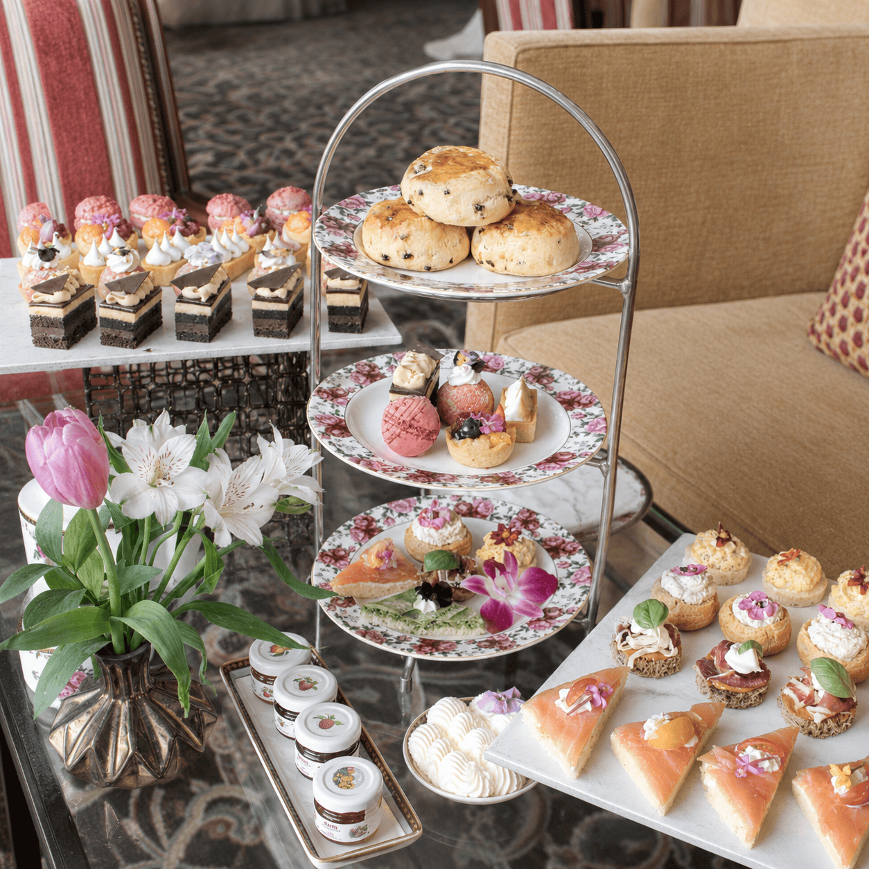 Afternoon tea with pastries, sandwiches and champagne at a luxury hotel
