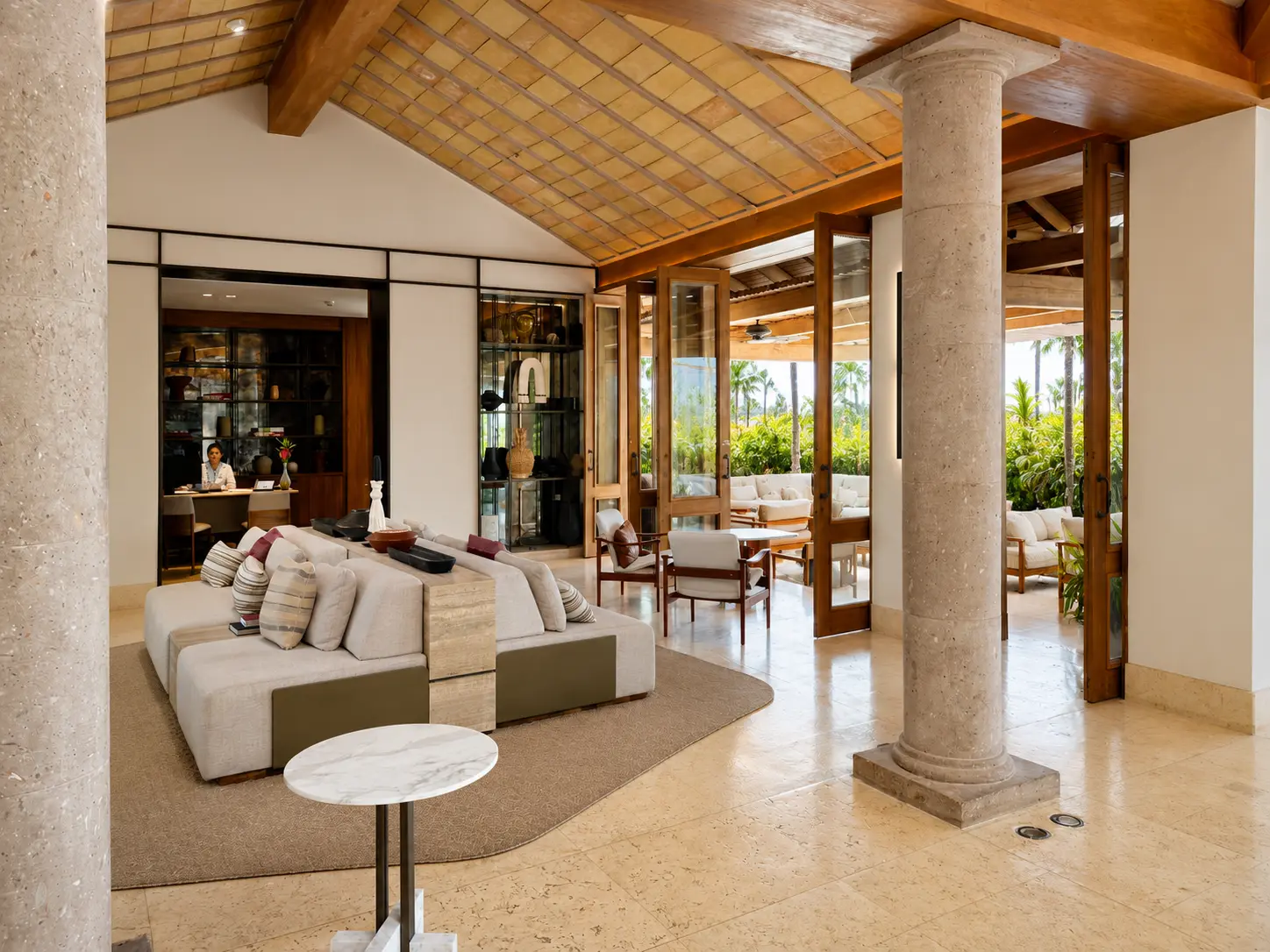 Open-air check-in lobby at St. Regis Punta Mita Resort featuring contemporary Mexican architecture and luxury seating.