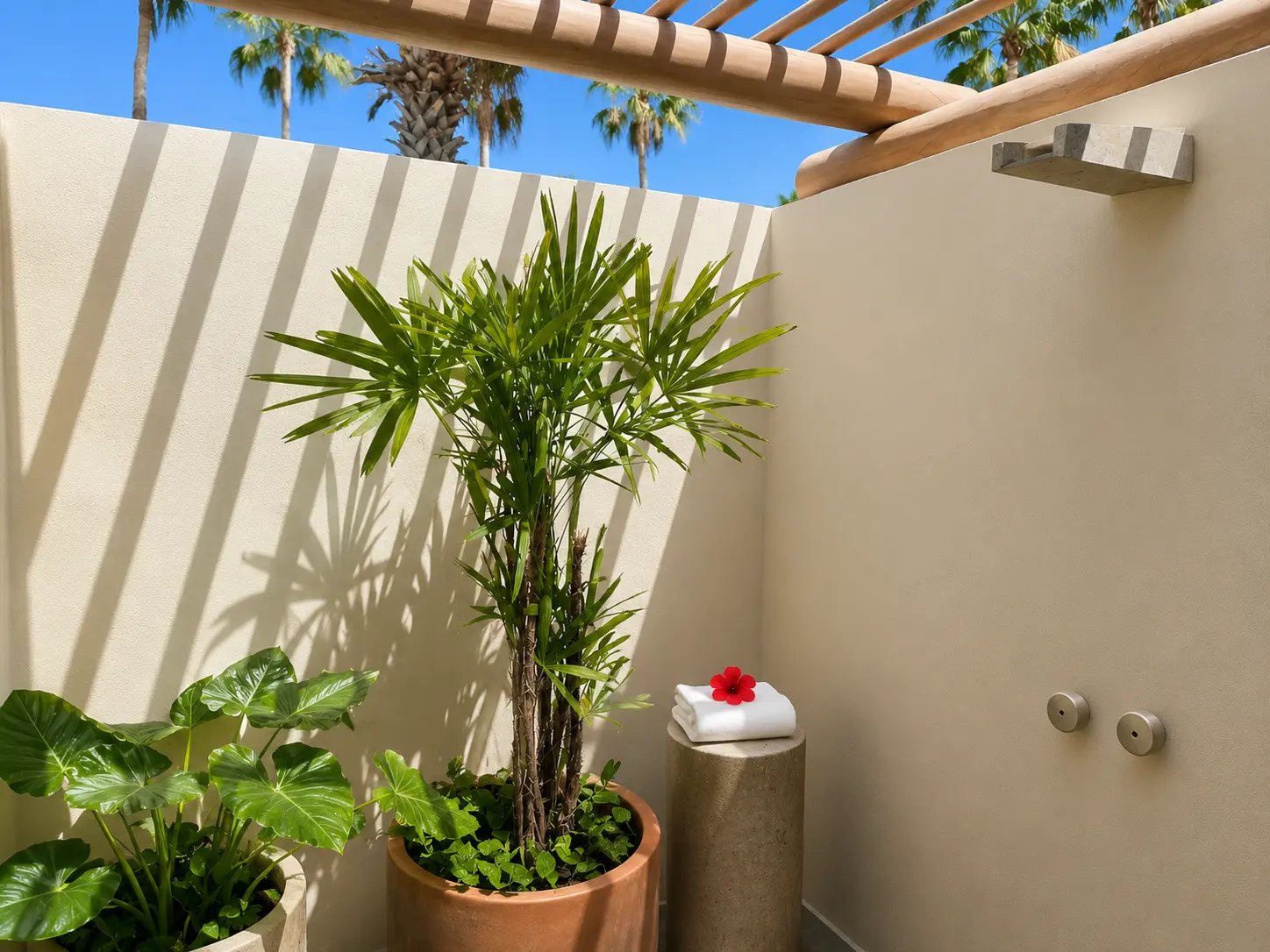 Private outdoor shower courtyard in an Ocean View Casita at The St. Regis Punta Mita with tropical plants and open-air design.