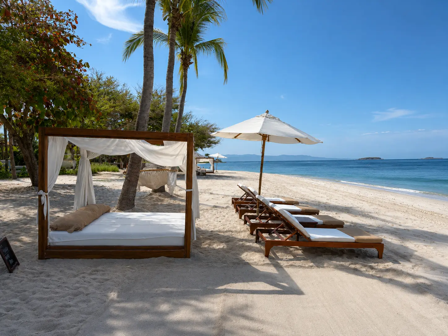 Beach cabanas and sun loungers overlooking the Pacific Ocean at The St. Regis Punta Mita.