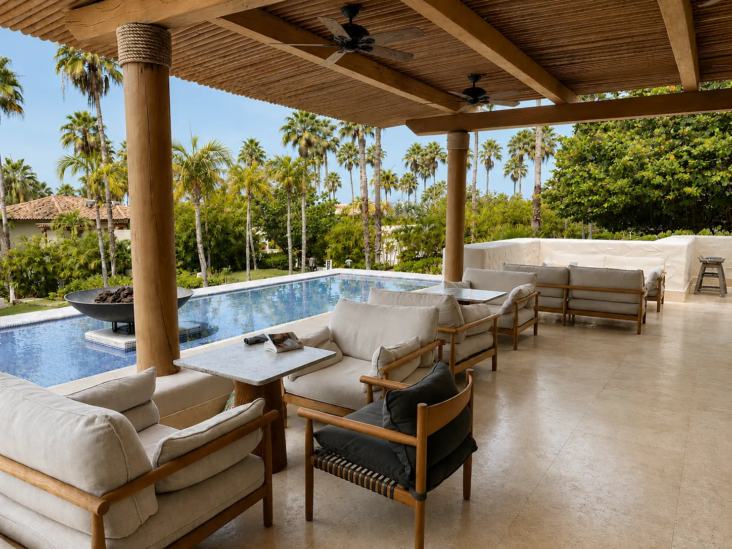 Covered terrace beside the lobby bar at The St. Regis Punta Mita with lounge seating, a reflecting pool and tropical gardens.