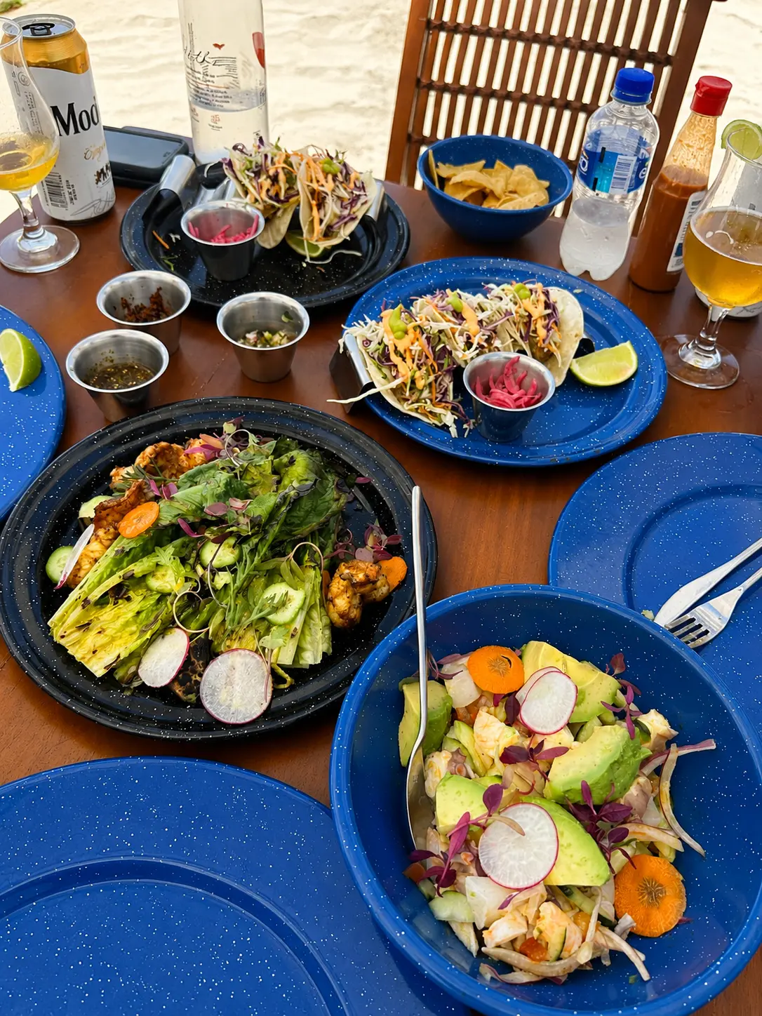 Seafood lunch with fish tacos, ceviche, grilled romaine salad and beers at Mita Mary, The St. Regis Punta Mita.