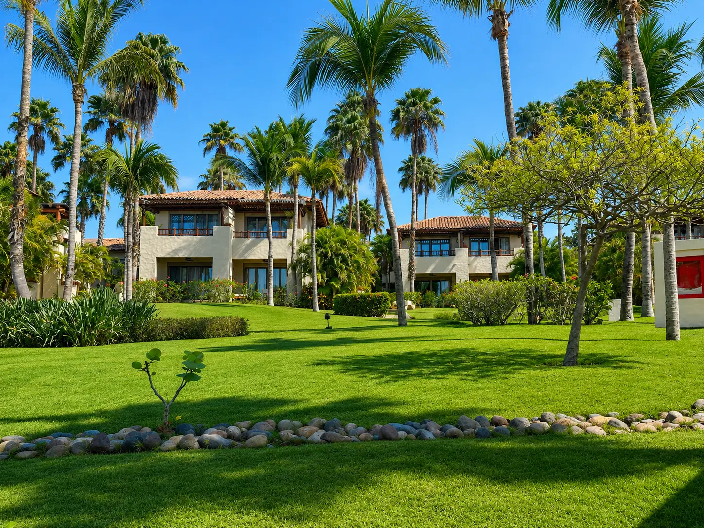 Garden View Casitas at The St. Regis Punta Mita surrounded by tropical gardens and palm trees.