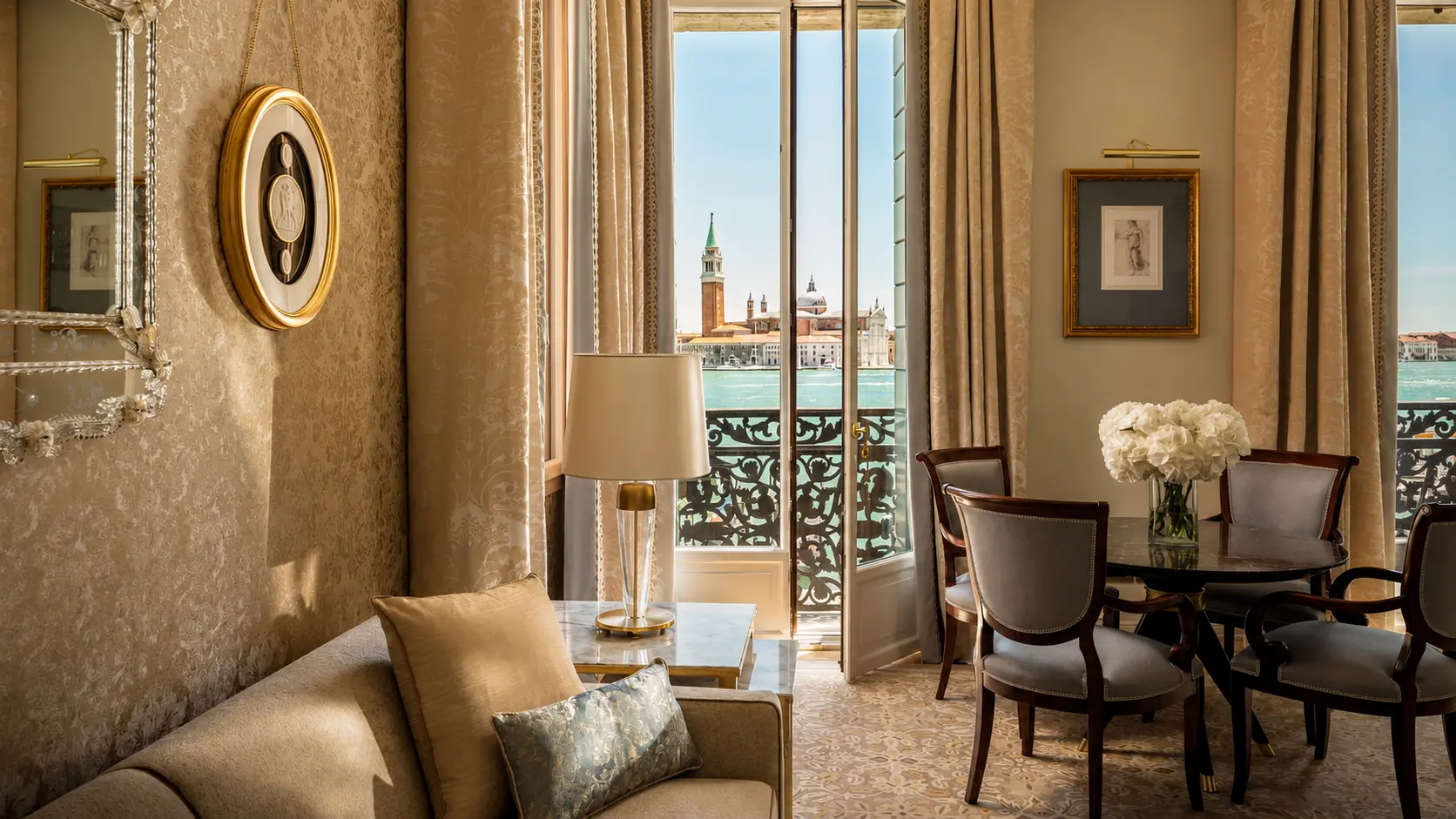 Premium Lagoon-View Suite at Four Seasons Hotel Danieli with a dining area, balcony and views of San Giorgio Maggiore.