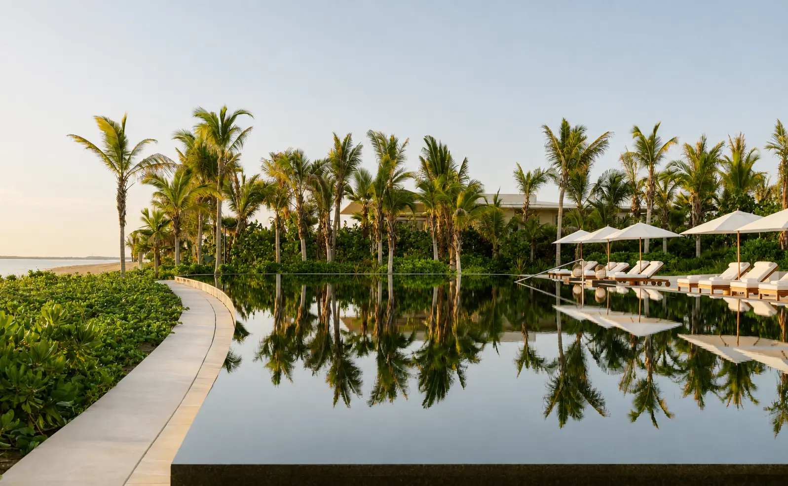 Infinity pool at Amanvari surrounded by palm trees and tropical gardens on Mexico's East Cape