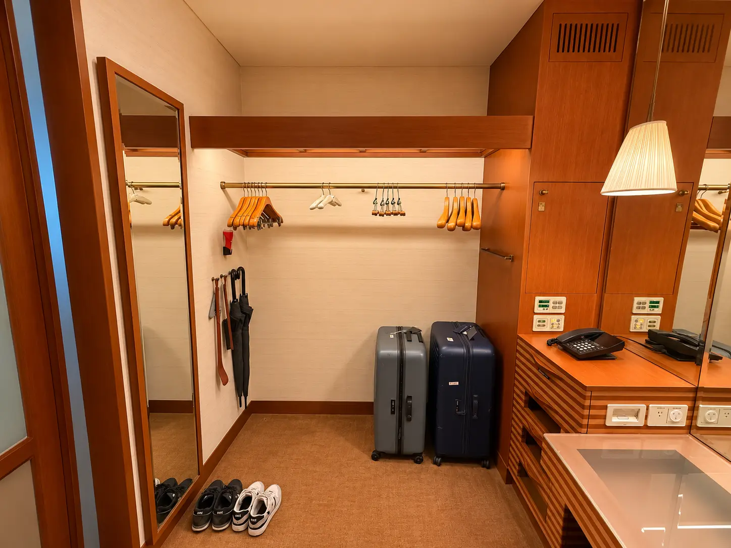 Walk-in wardrobe with luggage storage in a Premier Room at The Peninsula Tokyo
