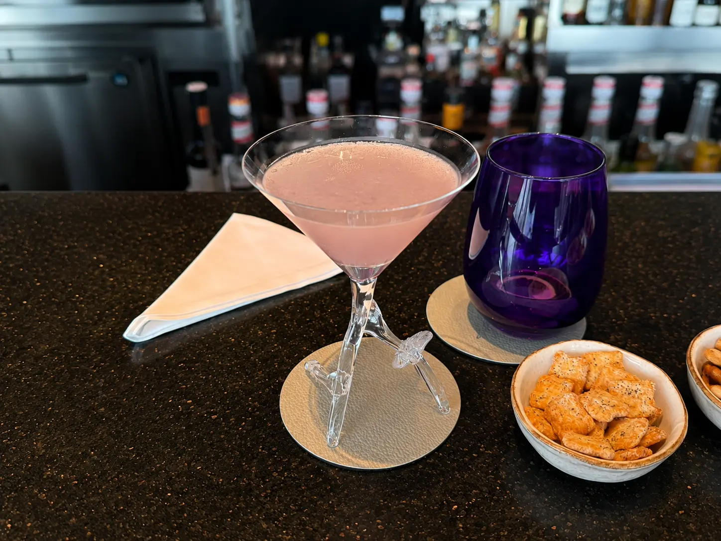 Cocktail served at Peter: The Bar at The Peninsula Tokyo with signature purple glassware.