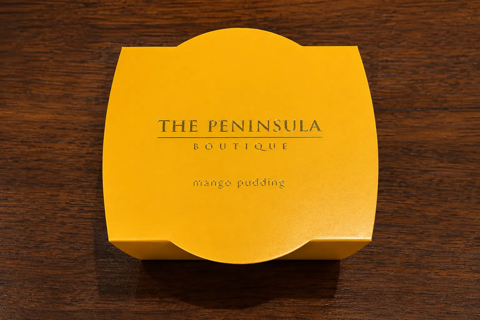 Mango pudding from The Peninsula Boutique at The Peninsula Tokyo in its signature yellow box.