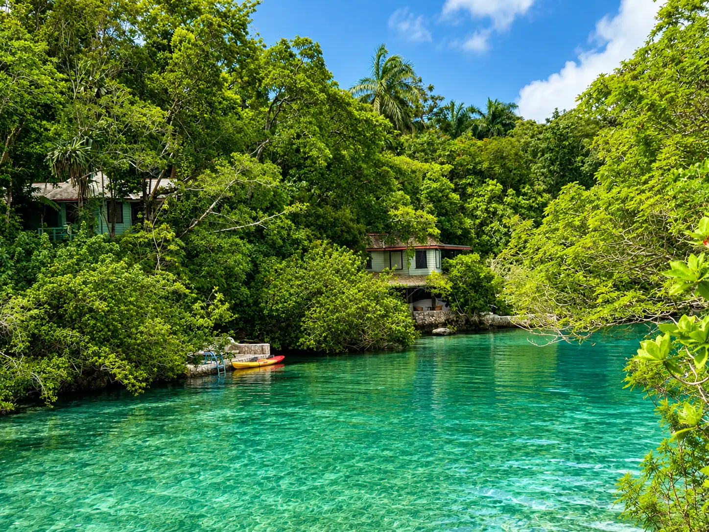 GoldenEye Jamaica villas and cottages surrounded by tropical gardens and lining the resort’s clear turquoise waterways.