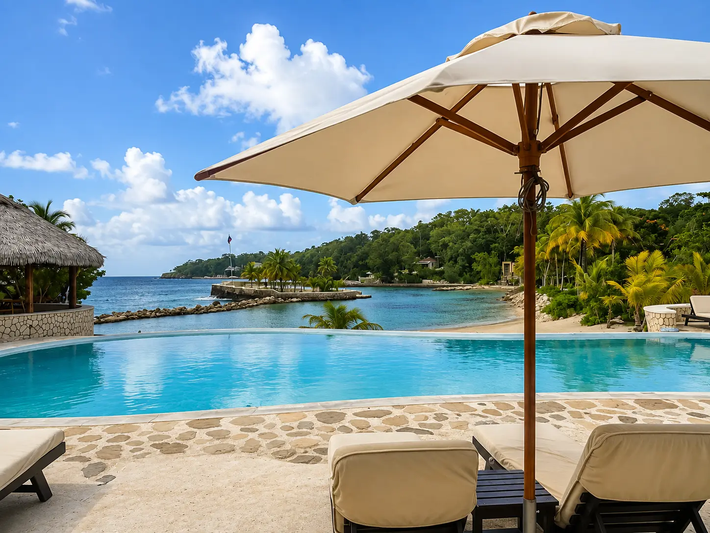 Infinity pool at GoldenEye Jamaica overlooking the sheltered beach and Caribbean Sea in Oracabessa.
