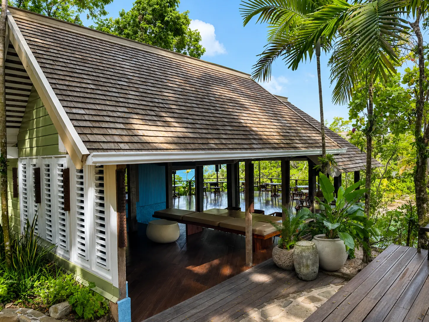 The Gazebo restaurant at GoldenEye Jamaica, surrounded by tropical gardens overlooking the lagoon.