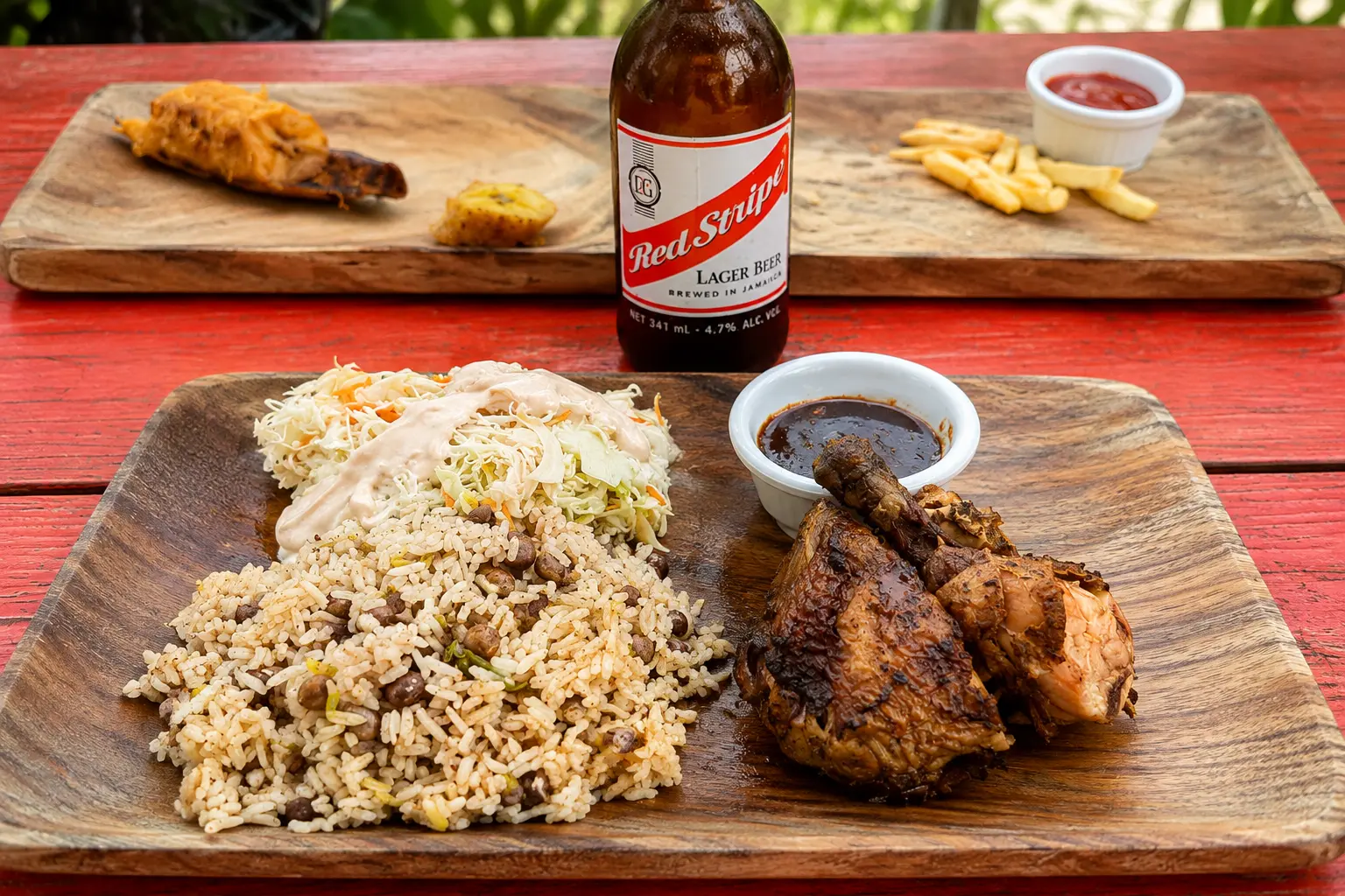 Jamaican jerk chicken with rice and peas and coleslaw at Bamboo Bar, GoldenEye Jamaica.