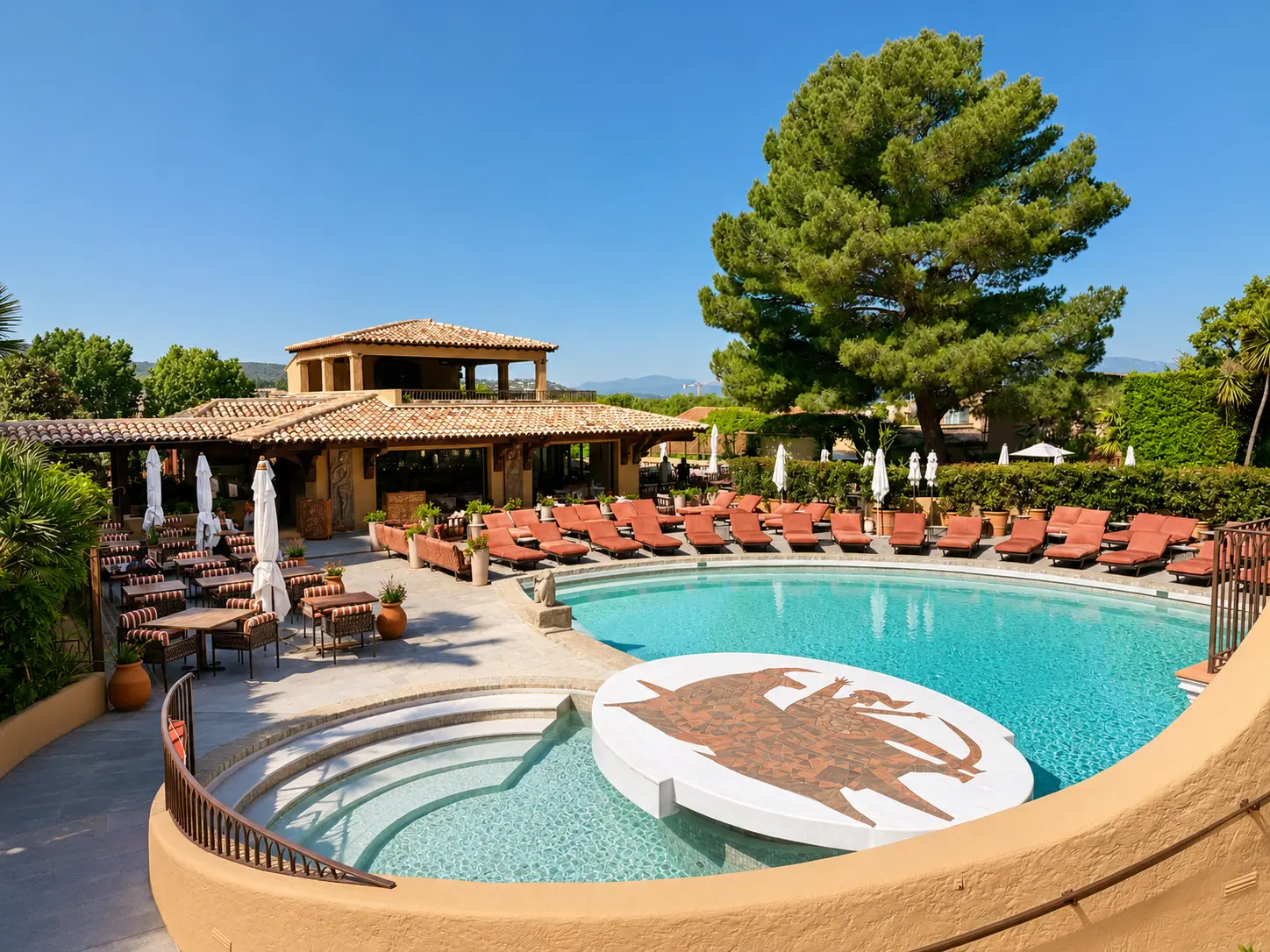 Pool at Byblos Saint-Tropez with the new Sky Bar above the main building