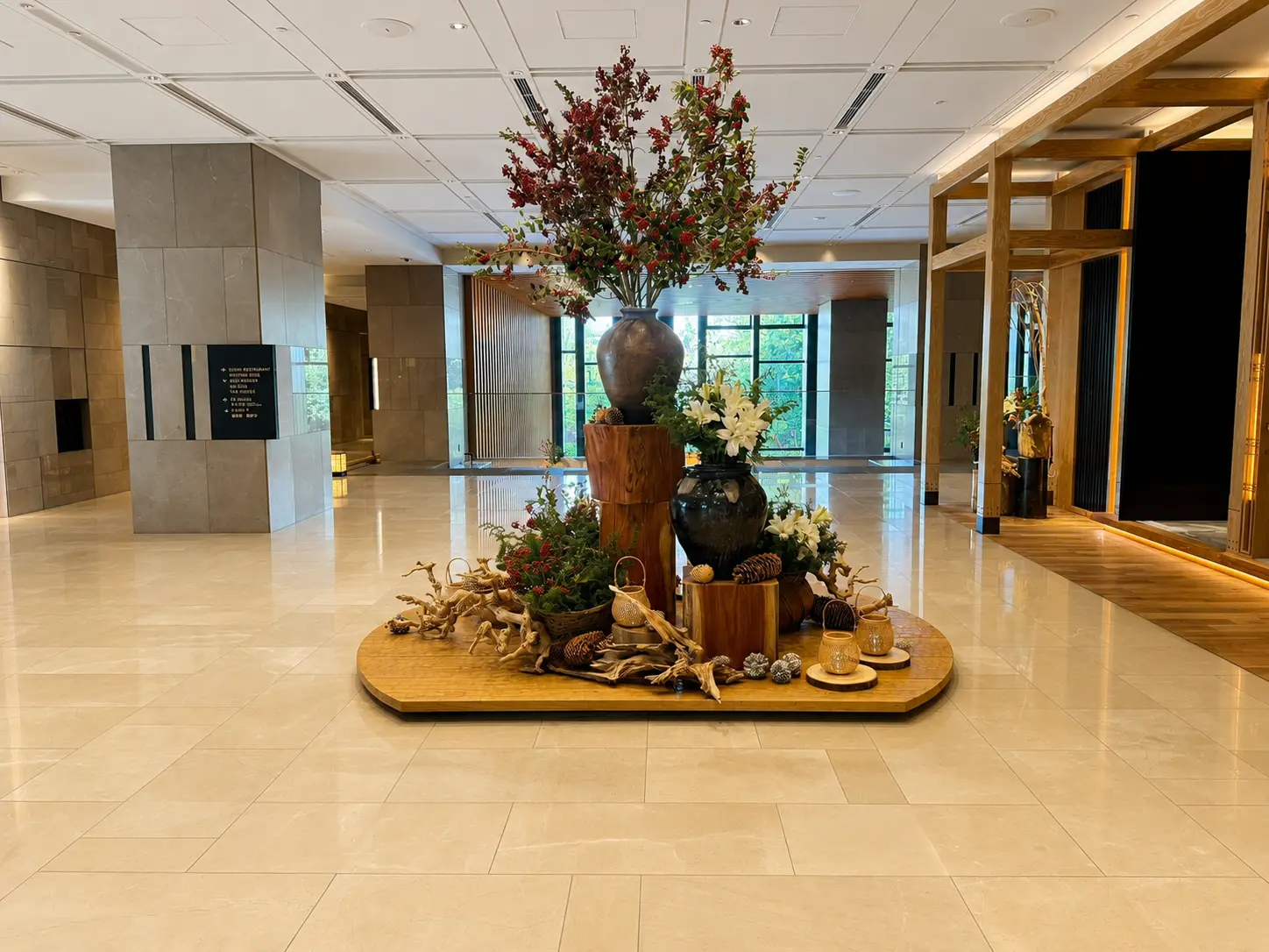 Contemporary Japanese lobby design at Four Seasons Hotel Kyoto with warm timber detailing and modern furnishings.