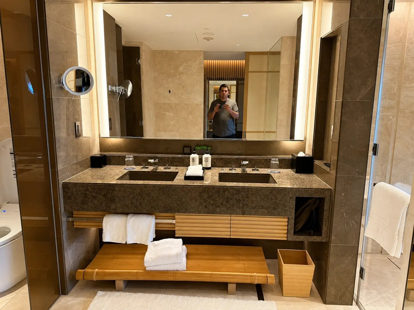 Luxury bathroom at Four Seasons Hotel Kyoto with soaking tub, separate shower and spacious vanity.