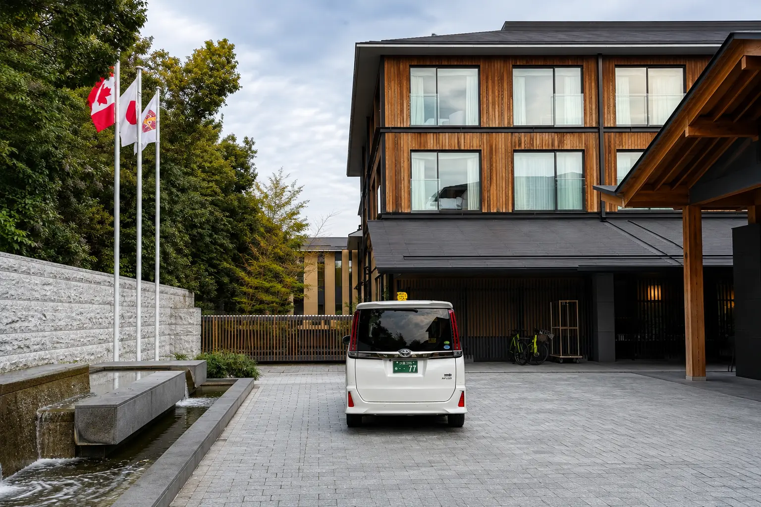 Exterior of Four Seasons Hotel Kyoto showing guest room windows overlooking the arrival area.