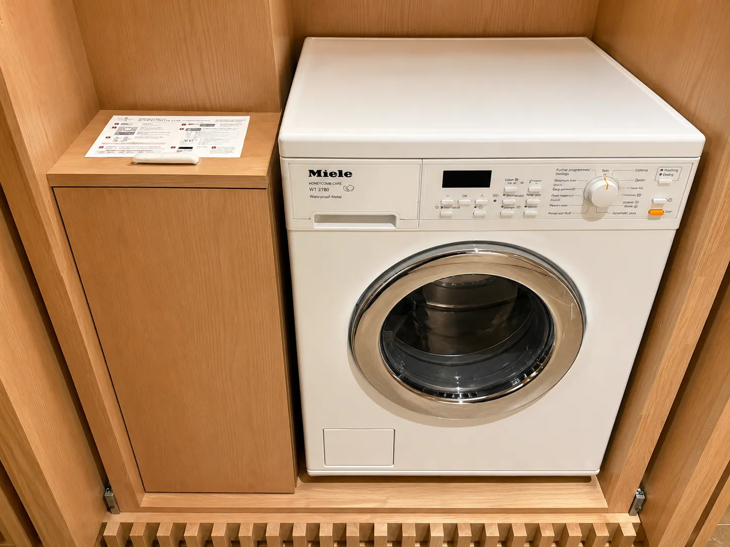 Washer and dryer inside a residence at Four Seasons Hotel Kyoto.