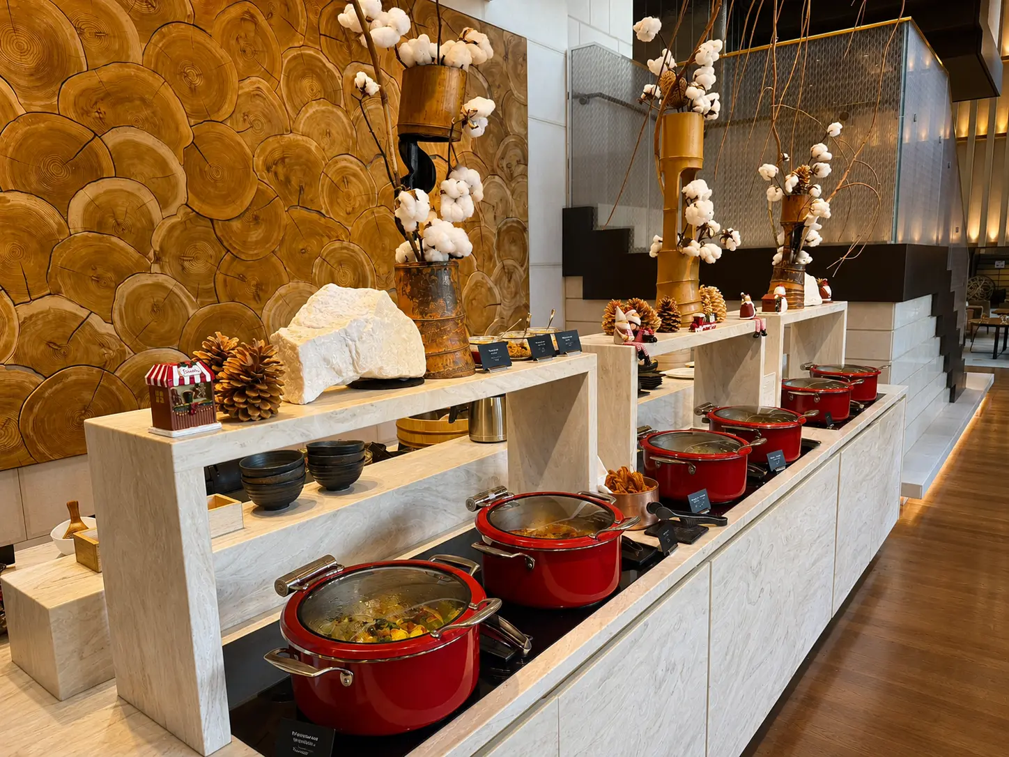 Breakfast buffet at EMBA Kyoto Grill inside Four Seasons Hotel Kyoto with hot dishes and Japanese seasonal decorations.