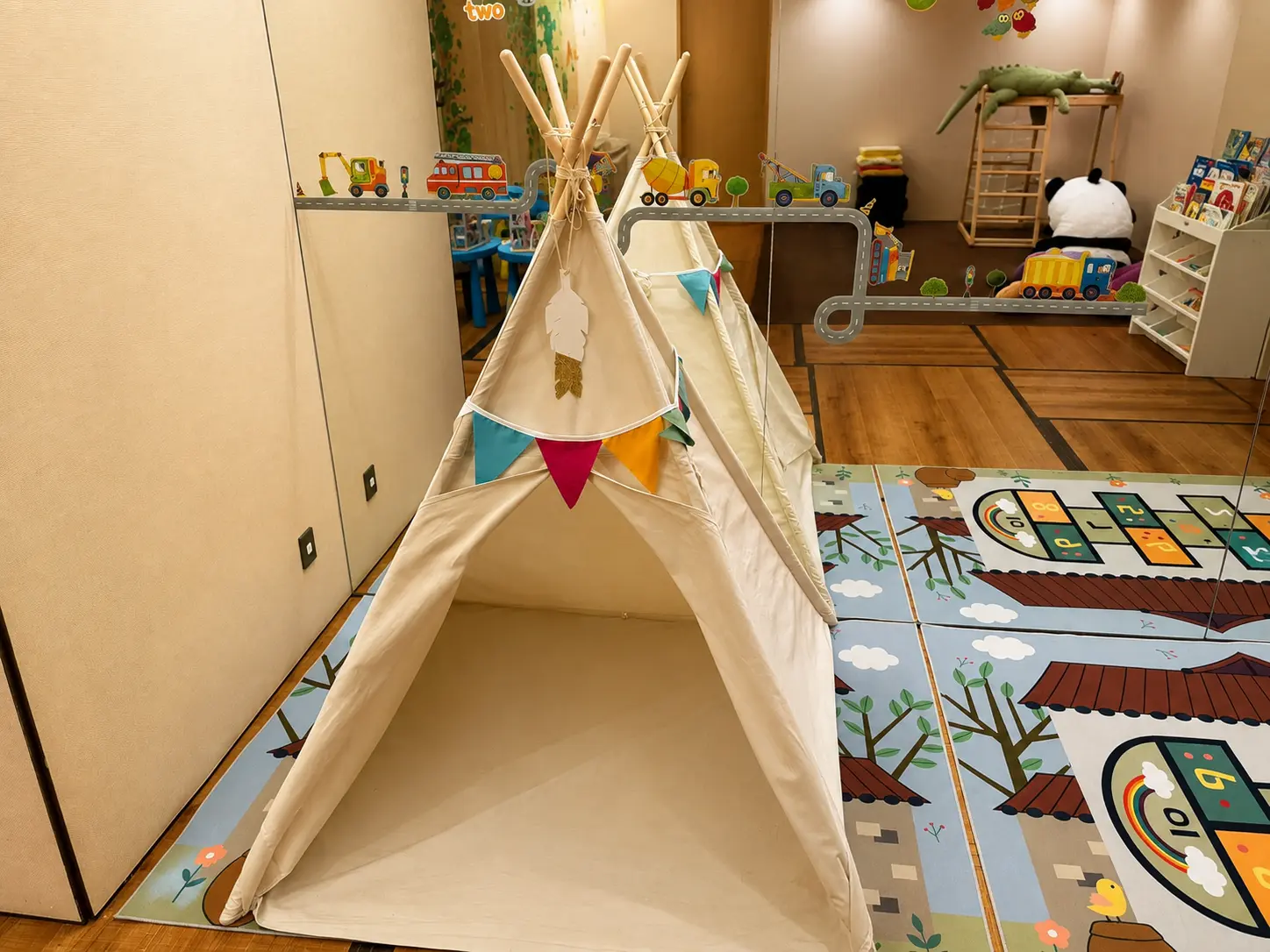Children's play area at Four Seasons Hotel Kyoto with books, toys and climbing equipment